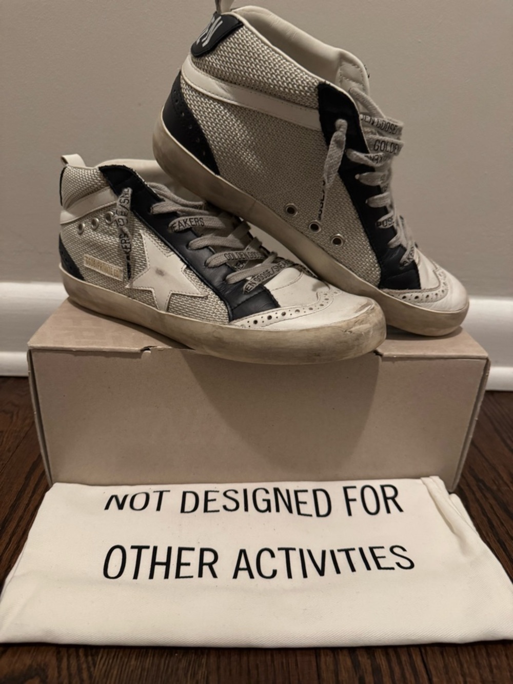 Golden Goose White and Black Mid-Top Sneakers